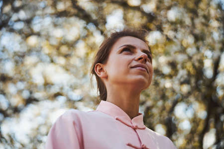 Focused woman staring in a distance in parkの写真素材