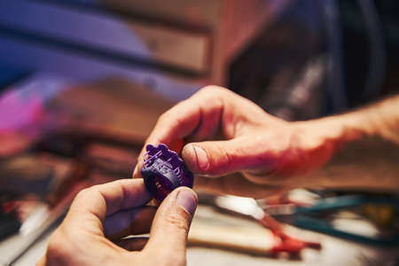 Jeweler preparing a wax model of ringの写真素材