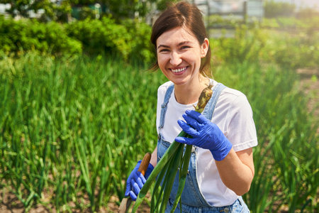 Smiling female person harvesting and preparing blanksの写真素材