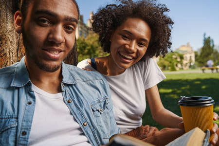 Beautiful loving couple posing outdoors in the park