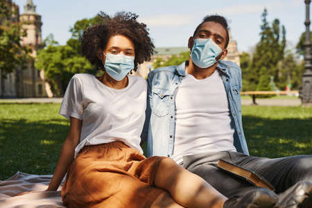 Young couple following health and safety regulationsの写真素材