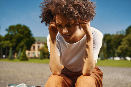 Worried young woman thinking about difficult situationの写真素材