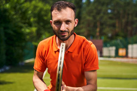 Focused male player preparing to return a serve