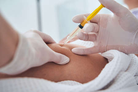 Close up of cosmetologist doing beauty shot
