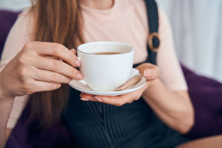 Close up of female hand holding cupの写真素材