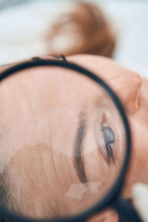 Focused photo on female forehead being with wrinklesの写真素材