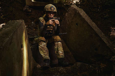 Female person having rest after military operationの写真素材