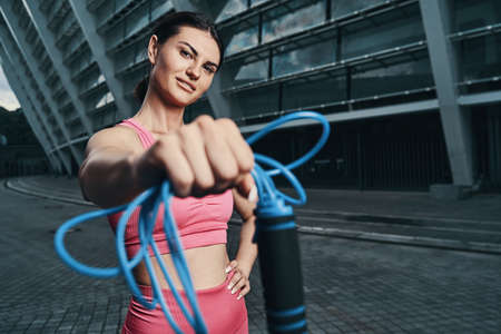 Female passing a skipping rope with right hand