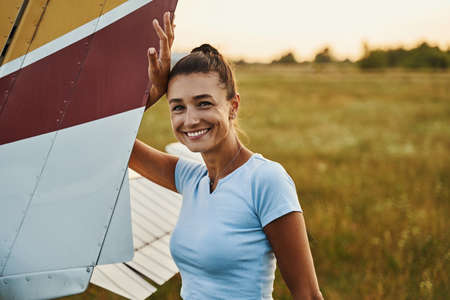 Joyful female person looking straight at cameraの写真素材