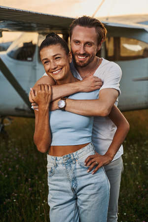 Joyful man embracing his girlfriend during walkの写真素材