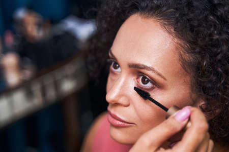Close up of female hand holding mascara