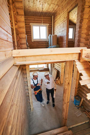 Builder is receiving instructions from construction engineer