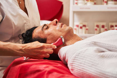 Facial skin care massage with microcurrent tool