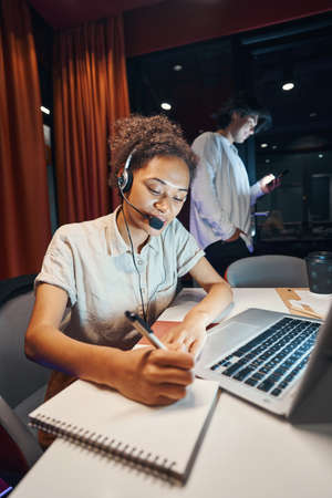 Female person working in support service of companyの写真素材