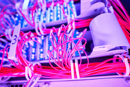 Bunch of cables in server rack with illuminationの写真素材