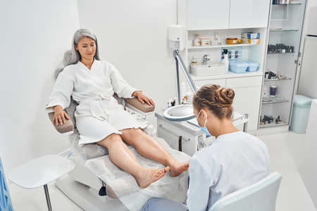 Relaxed international woman being in beauty salonの写真素材