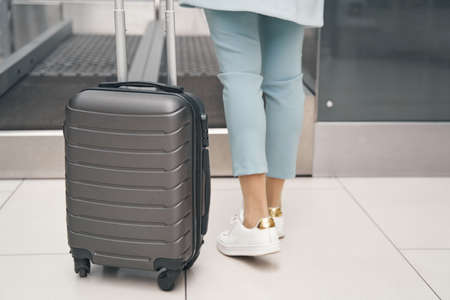 Air traveler using self-service baggage drop-off systemの写真素材