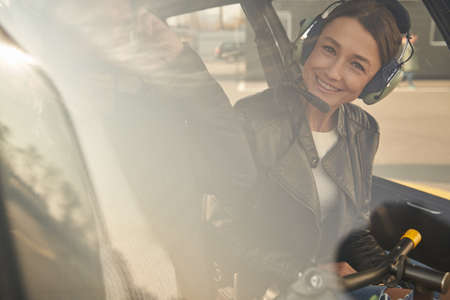 Smiley brunette lady getting ready to fly a copterの写真素材