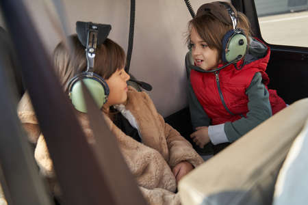 Kids in piloting headsets having an air travelの写真素材