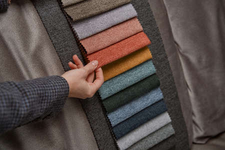 Customer choosing right upholstery material for couchの写真素材