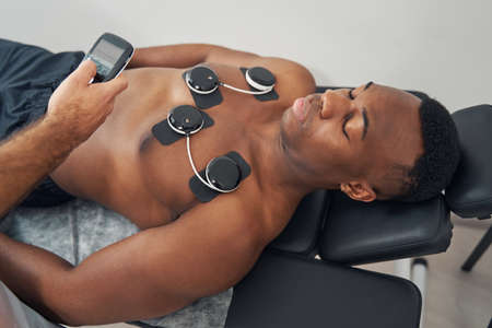 Young African American man receiving EMS treatmentの写真素材