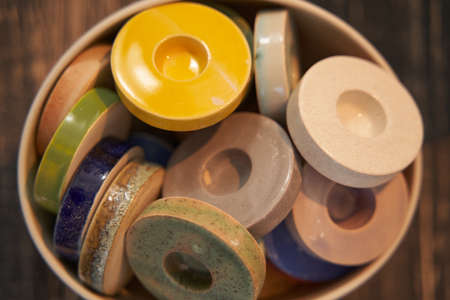 Set of round colorful glazed ceramic candle-holdersの写真素材