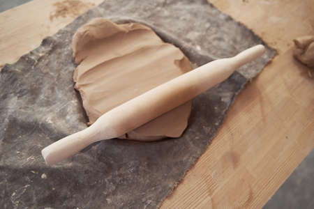 Used pottery tool left on rolled-out clay slab