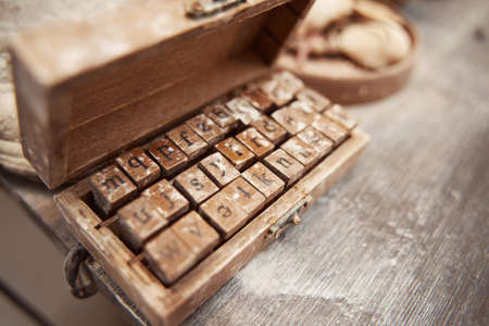 Decorative alphabet stamp set made of wood and rubber