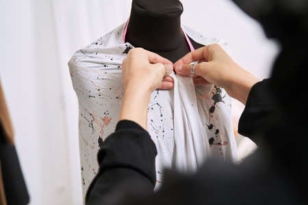 Muslim female designer making traditional handmade dressの写真素材