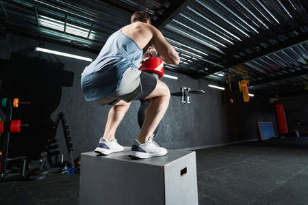 Professional male athlete doing plyometric training indoorsの写真素材