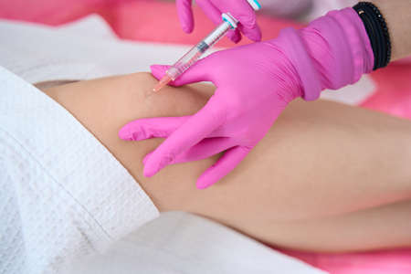 Collagen injection in the knee to reduce wrinkles and skin firmnessの写真素材