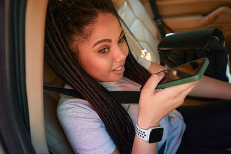 Young female passenger daydreaming during car ride