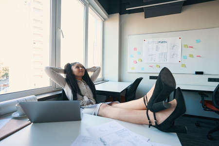 Young residential designer taking break from workの写真素材