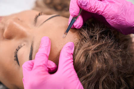 Young woman is being cleaned with a special tool