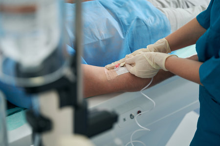 Patient in the hospital is put on a drip with medicineの写真素材