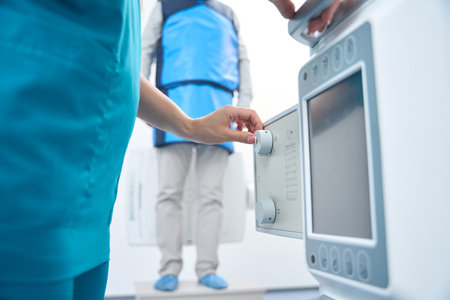 Medical staff works with an injector to remove the contrast
