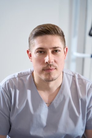 Portrait of young military doctor against background of medical simulatorsの写真素材