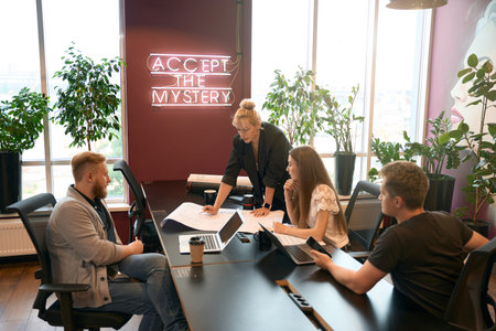 Group of design professionals analyzing floor plan