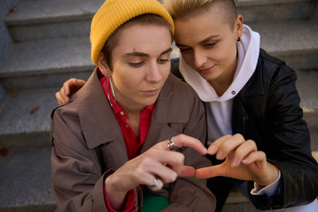 Modern women make up after a quarrelの写真素材