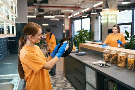 Cleaning female team cleaning in kitchen area , women in work clothesの写真素材
