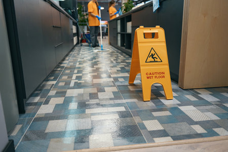 Warning sign Attention wet floor stands indoors on floorの写真素材