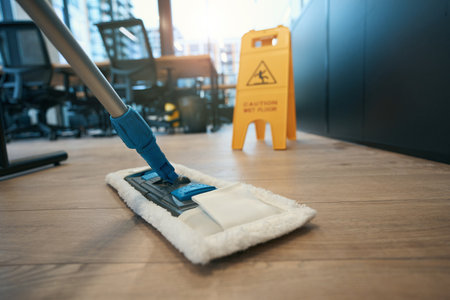 Cleaning coworking space with special mop, next to folding stepladder