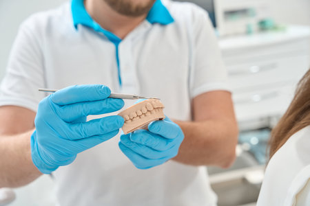 Doctor discussing dental plaque buildup with client