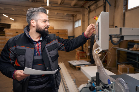Adult male working in the woodhouse manufactory