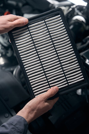 Man changing spare parts in the car