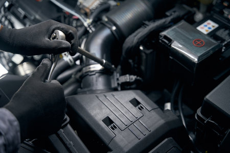 Man conducts full technical inspection of autoの写真素材