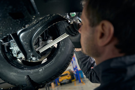 Mechanic checking boot collars in the workshop