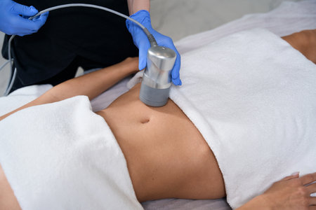 Medical worker doing course of anti-aging procedures for skinの写真素材