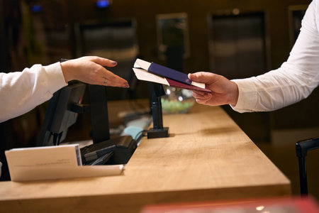 Male guest is checking into at hotelの写真素材