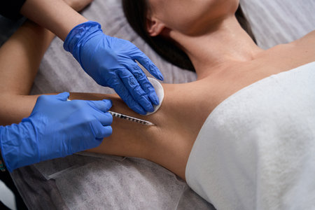 Medic doing injections in salon to lady